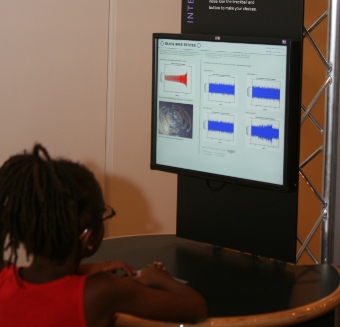 A photo of a girl playing the Black Hole Hunter game